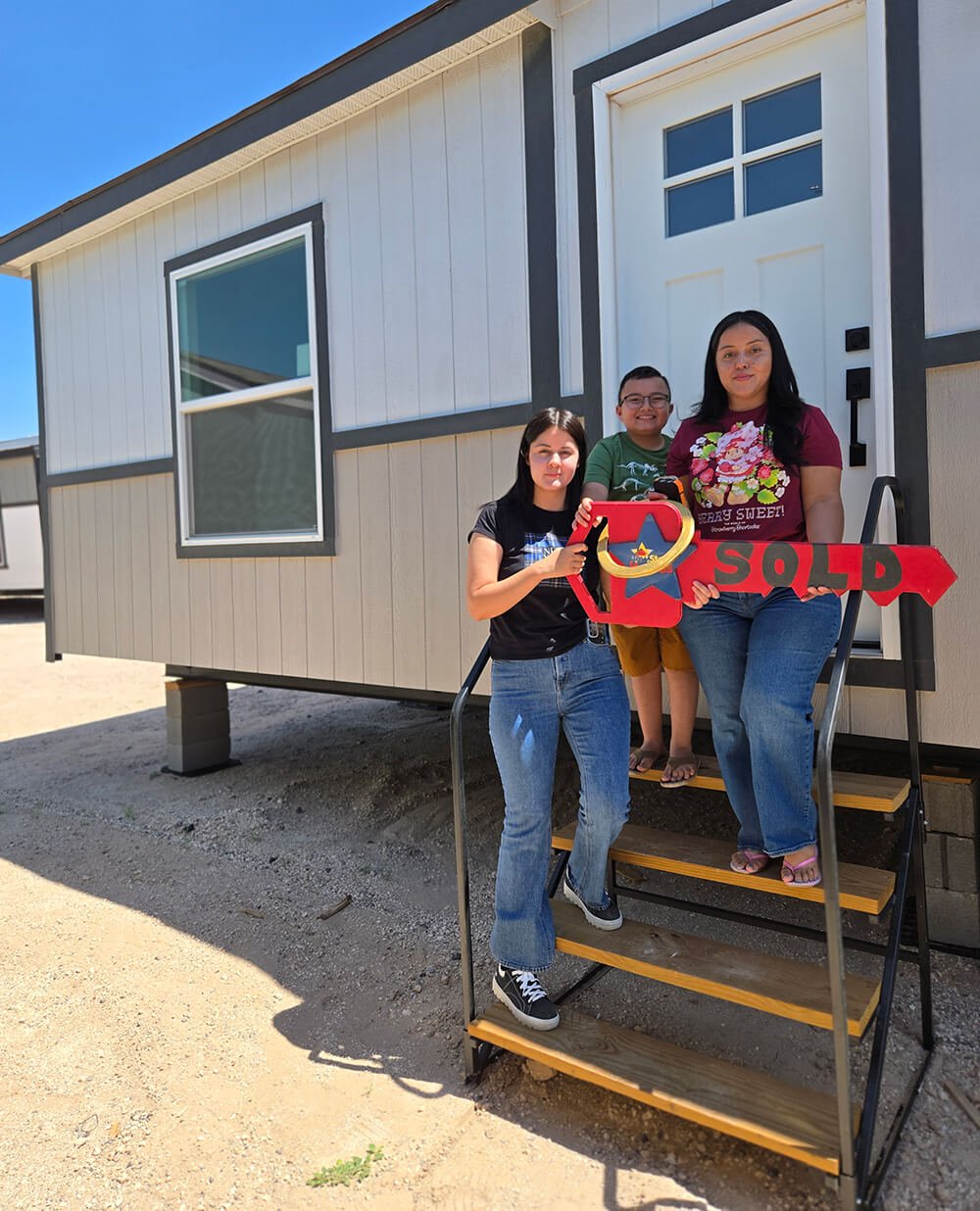 Smiling happy family in El Paso, Texas - affordable home ownership